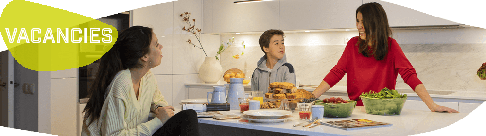 Woman and children talking at a table Woman and children talking at a table